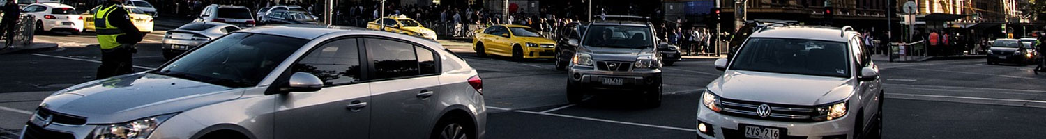 Various cars on a busy Melbourne street.