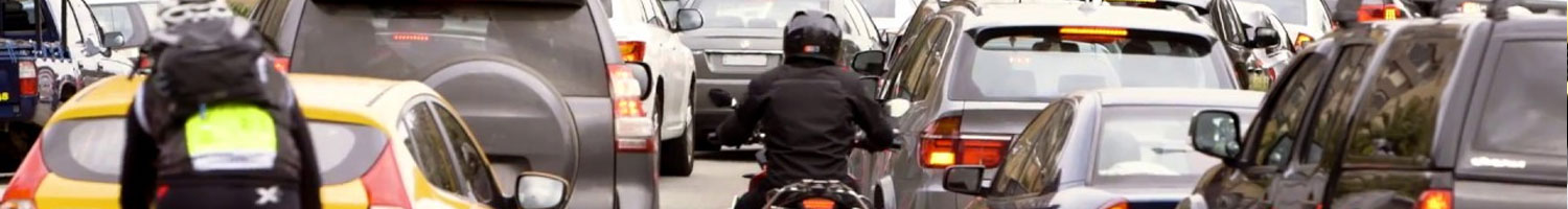 A motorcycle in the middle of traffic.